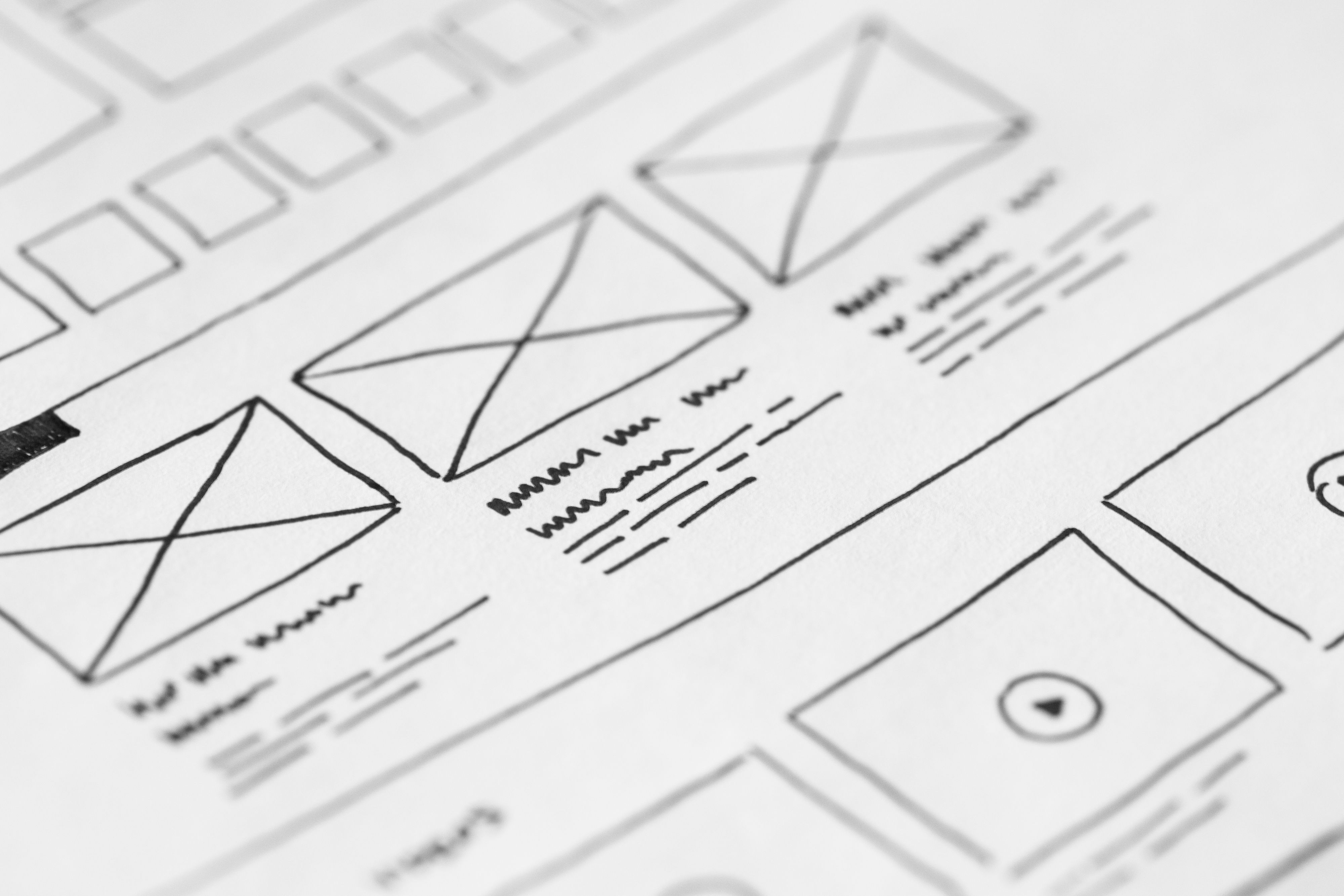 UI/UX designer working on wireframes and prototypes in Figma
